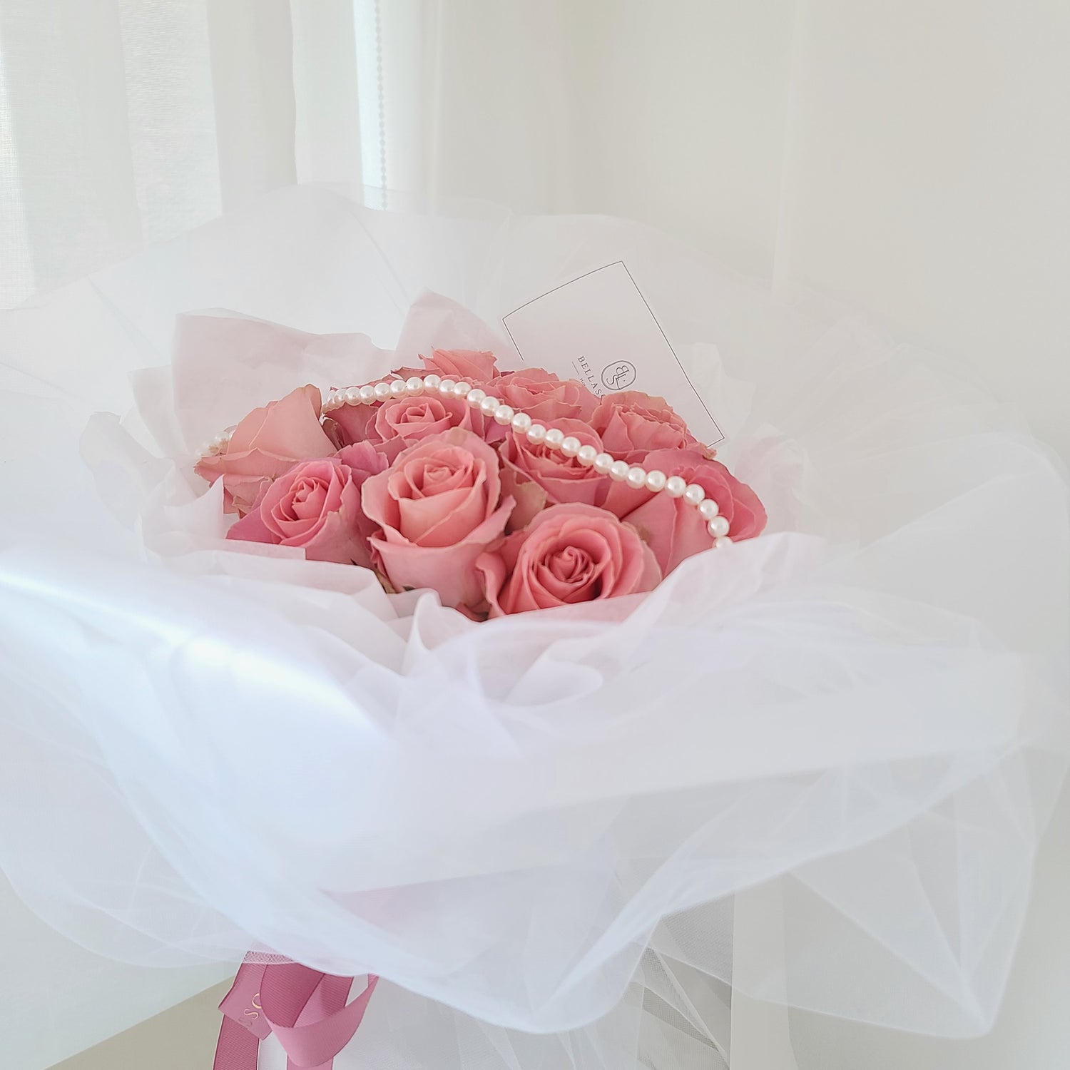 Close-up of 12-rose Be My Valentine Bouquet with fairy-tale shiffon wrap and pearl detail, delivery across Vancouver or Metrotown pick-up