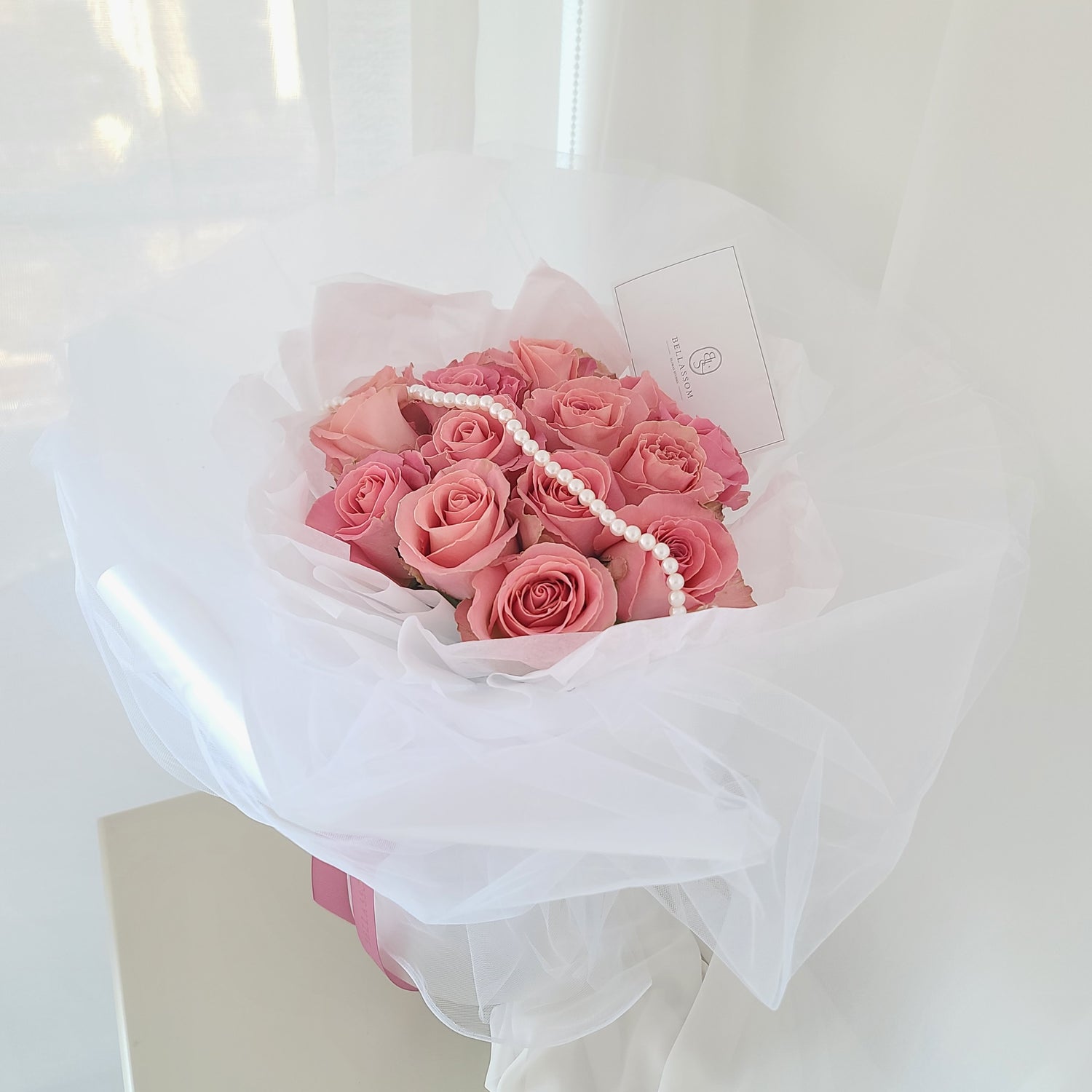 Side view of Be My Valentine Bouquet showing elegant arrangement of 12/24 roses and shiffon-effect wrap, delivery across Vancouver or pick-up from Metrotown