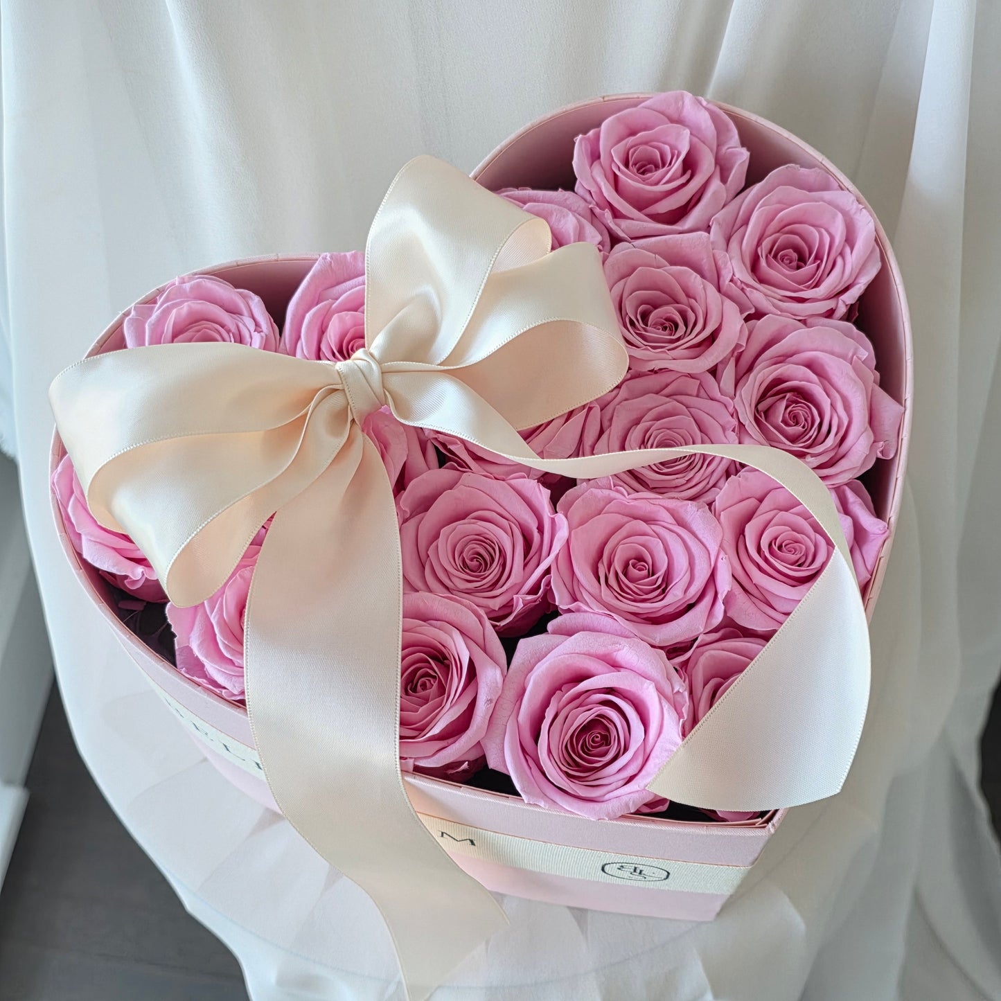 Close-up of preserved roses in Forever Love heart box arrangement