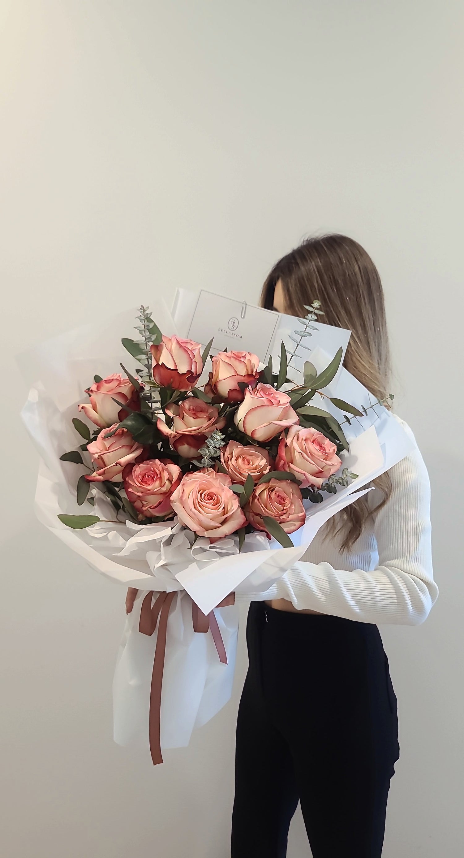 Rosy rose arrangement with eucalyptus for anniversaries and romantic occasions in Vancouver