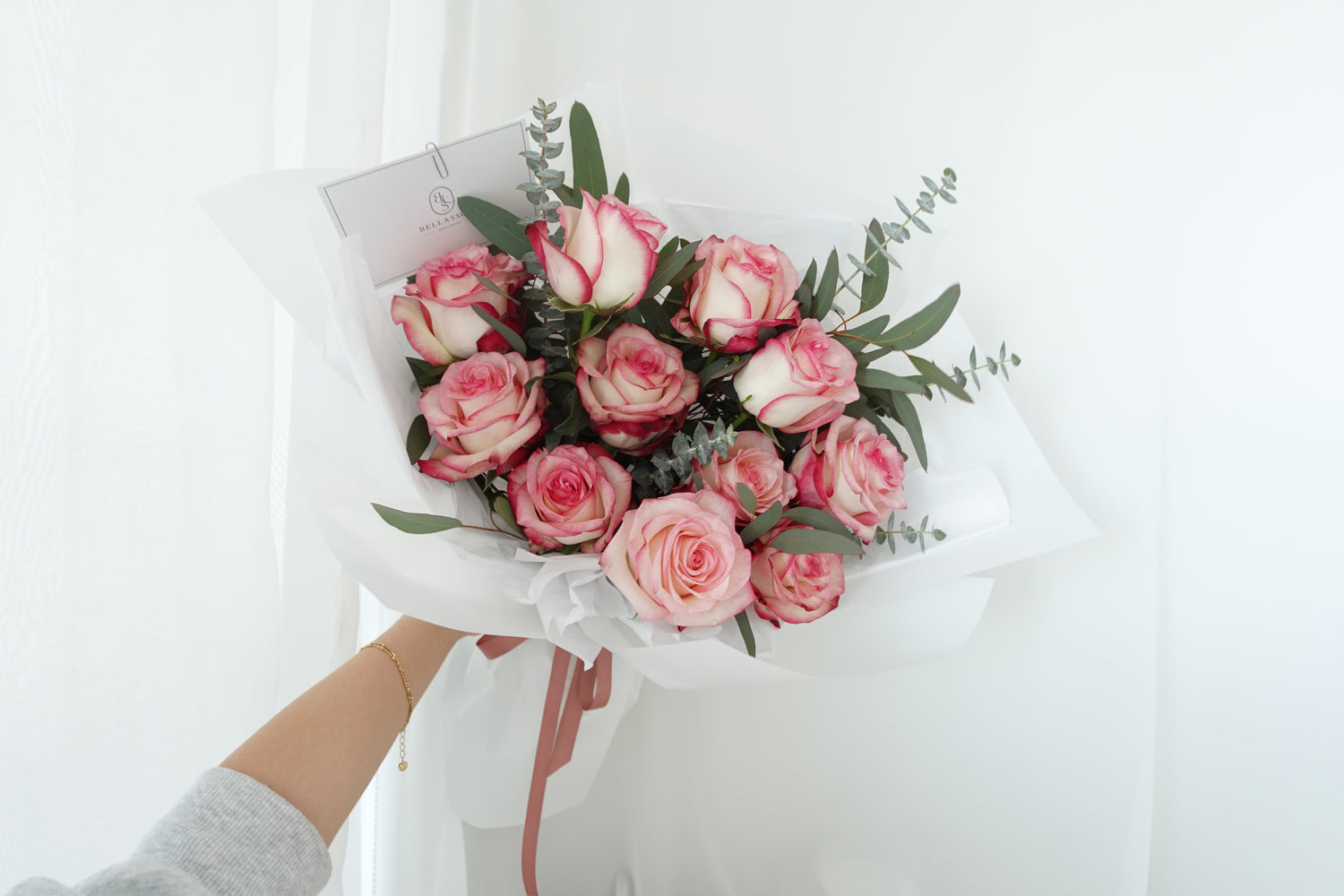 Premium rosy rose bouquet with eucalyptus, presented as a romantic gift with same-day delivery in Vancouver