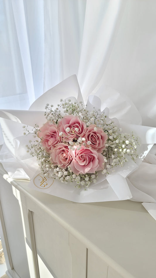 Top view of petite rose bouquet with delicate blooms, perfect for birthdays, anniversaries, or everyday moments, located in Metrotown