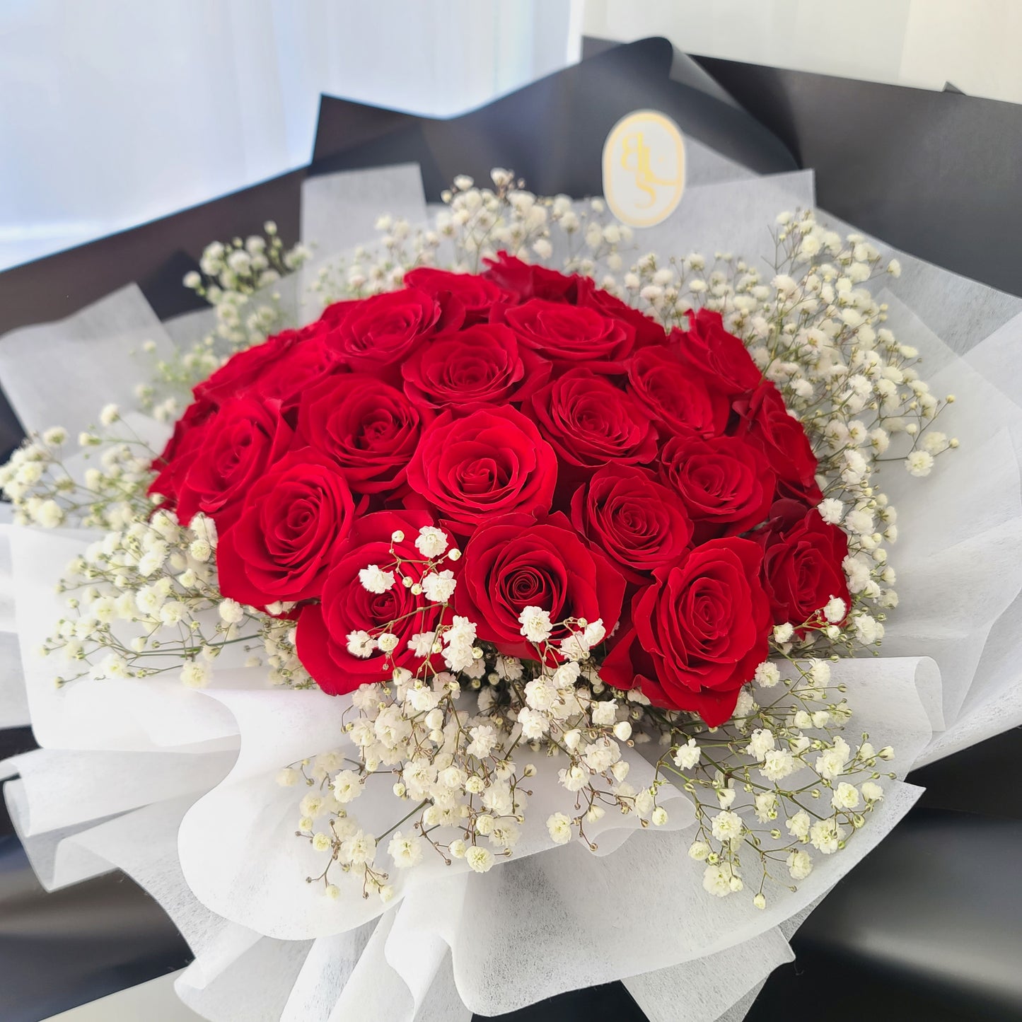 Top view of Classic Red Rose with Baby’s Breath bouquet featuring premium roses in black wrap, ideal for Valentine’s Day, romantic gestures, or special occasions, delivery across Vancouver or Metrotown pick-up

